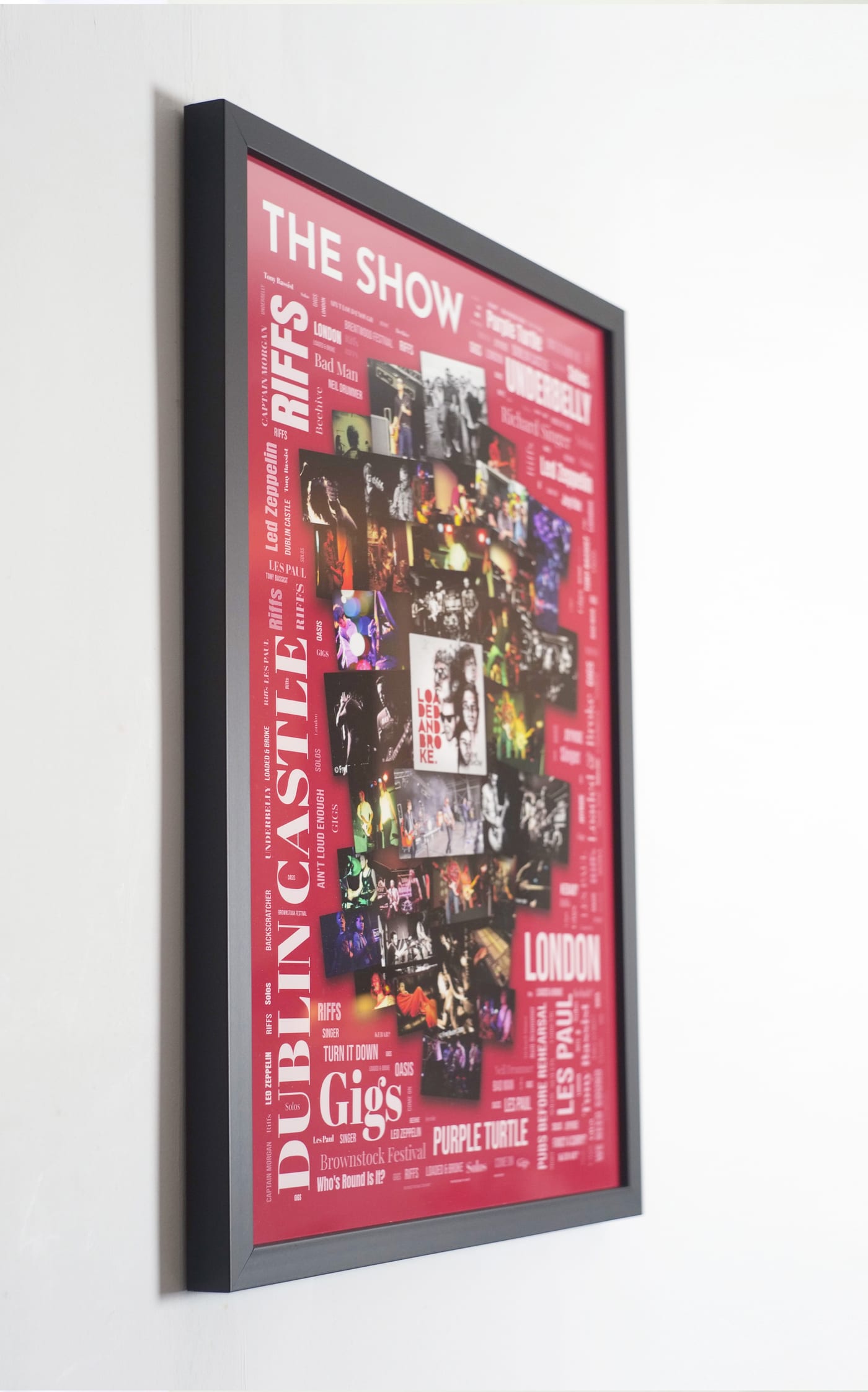 A2 Framed Print Word Art Collage hanging on a wall